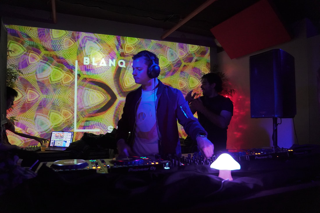 Funkoscope DJing with custom VJ visual backdrop